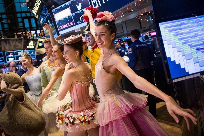 New York City Ballet dancers from this year's production of The Nutcracker visit the floor of the New York Stock Exchange on the morning of Dec 24, 2014 in New York City.&nbsp;The Dow on Wednesday edged to a fresh record in a holiday-shortened sessio