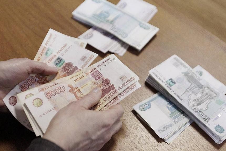 Russia says its currency crisis is over even though its forex reserves have plunged and annual inflation has climbed above 10 per cent. -- PHOTO: REUTERS