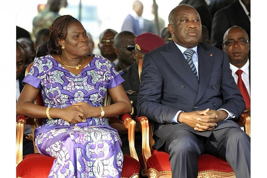 This file picture dated on Feb 4, 2011 shows former Ivory Coast President Laurent Gbagbo (right) and his wife Simone attending a ceremony, in Abidjan, to pay tribute to thirty-two members of the National Armed Forces of Ivory Coast (FANCI) that lost 
