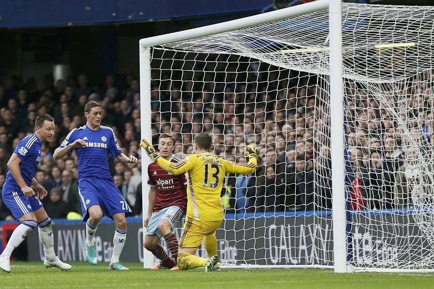 Chelsea's John Terry (left) scores a goal against West Ham United during their English Premier League football match at Stamford Bridge in London, Dec 26, 2014. -- PHOTO: REUTERS