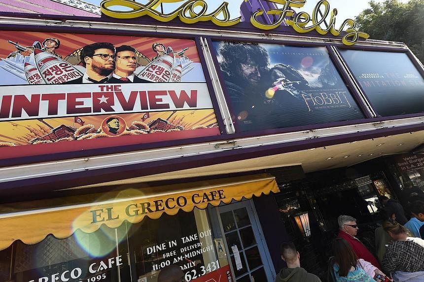 Movie-goers wait in line outside the Los Feliz 3 Cinema in Los Angeles, California Dec 25, 2014 to by tickets for the The Interview. -- PHOTO: AFP