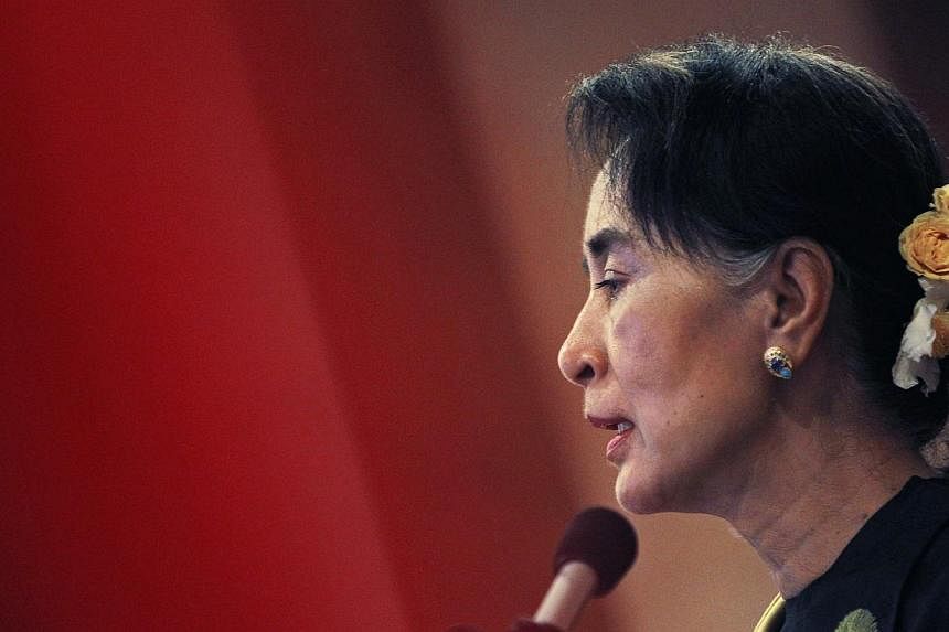 Myanmar's opposition leader Aung San Suu Kyi speaks at the National League for Democracy Party's central comity meeting at a restaurant in Yangon on Dec 13, 2014. -- PHOTO: REUTERS
