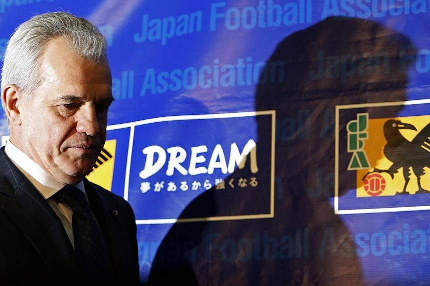 Japan's national soccer team head coach Javier Aguirre walks into a news conference at the Japan Football Association headquarters in Tokyo Dec 27, 2014. -- PHOTO: REUTERS