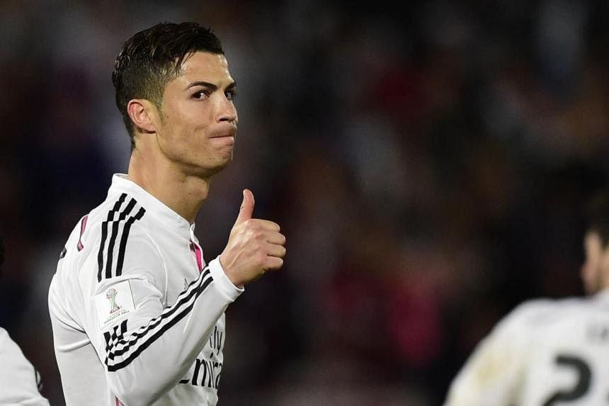 Real Madrid's Portuguese forward Cristiano Ronaldo gives the thumbs up during the FIFA Club World Cup final football match against San Lorenzo at the Marrakesh stadium in the Moroccan city of Marrakesh on Dec 20, 2014. Not content with four titles in