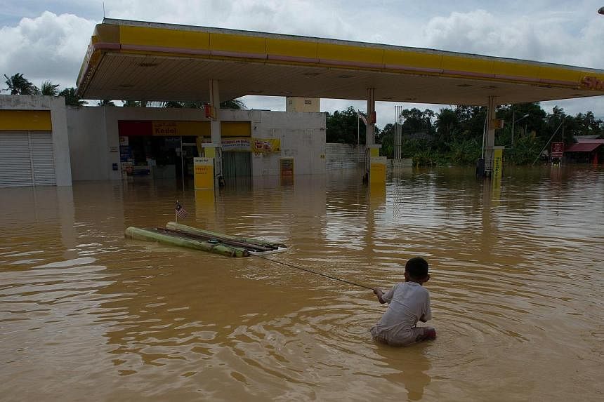 Kelantan (above) has been hit the hardest by the floods. Other states badly affected are Pahang, Terengganu and Perak. The southern state of Johor is the latest to be affected and flash floods have also hit Kuala Lumpur. At least five people have bee