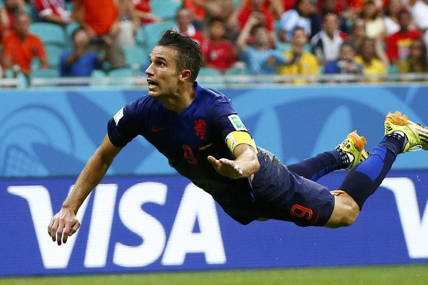 Robin van Persie’s diving-header goal for Netherlands in their 5-1 win against Spain has become one of the iconic images of the 2014 World Cup in Brazil. -- PHOTO: ACTION IMAGES