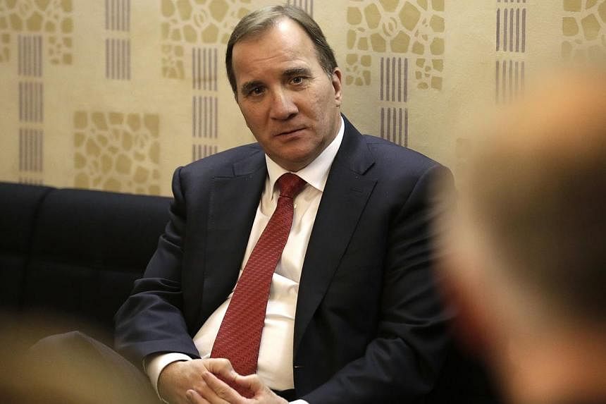 Sweden's Prime Minister Stefan Lofven listens to professors of the Stockholm School of Economics in Riga on Oct 21, 2014. -- PHOTO: REUTERS