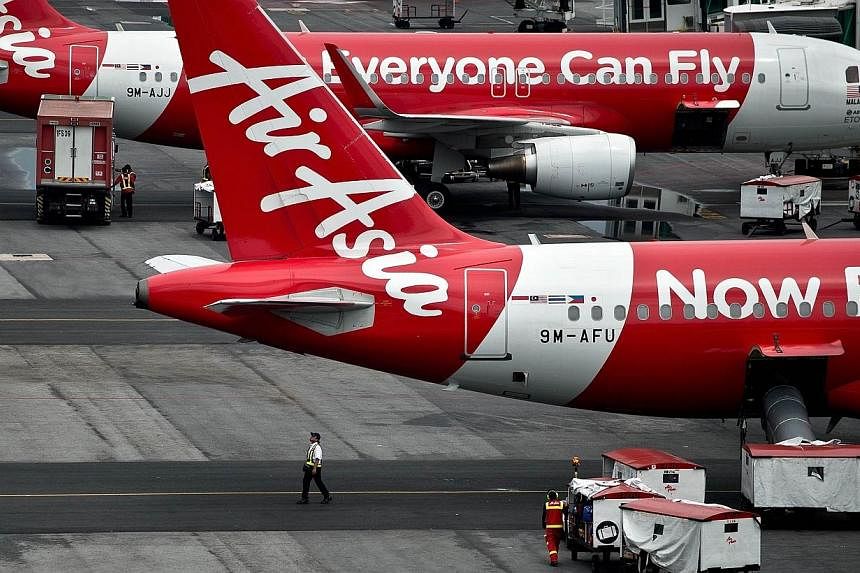 An AirAsia flight en route to Pulau Langkawi had to turn back due to "technical issues" some 10 minutes after taking off from Penang on Sunday afternoon. -- PHOTO: AFP