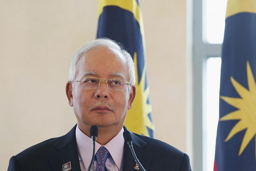 The Malaysian Government will assist AirAsia to help find flight QZ8501, said Prime Minister Najib Razak. -- PHOTO: REUTERS