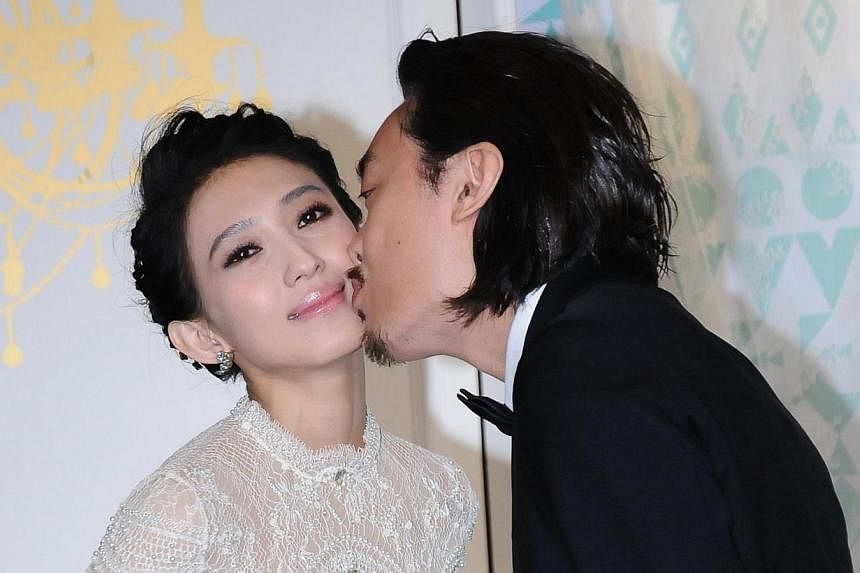 Malaysian singer Penny Tai married Taipei gallery owner Sidney Lu on Saturday at&nbsp;Taipei's Songshan Cultural and Creative Park. -- PHOTO: XINHUA