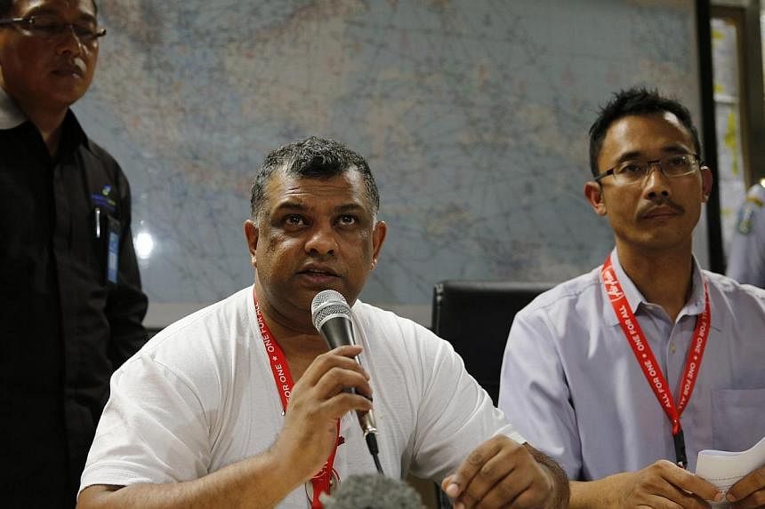 Air Asia CEO Tony Fernandes (left) sits beside Indonesia Air Asia CEO Sunu Widyatmoko (right) as they hold a news conference at Surabaya's Juanda International Airport on Dec 28, 2014. Mr Fernandes described the disappearance of QZ8501 from Surabaya 