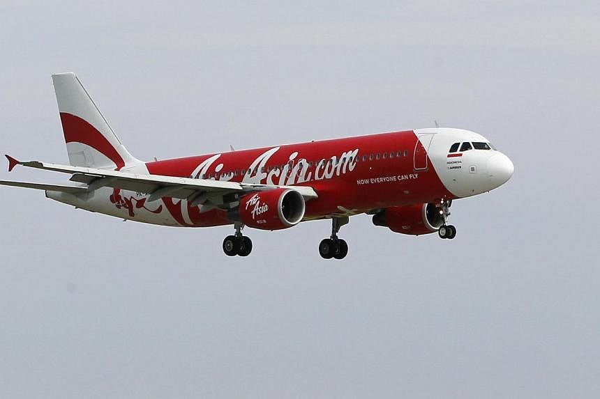 An Indonesia AirAsia Airbus A320-200 passenger preparing to land at Sukarno-Hatta airport in Tangerang on the outskirts of Jakarta in this Jan 30, 2013 file picture. -- PHOTO: REUTERS