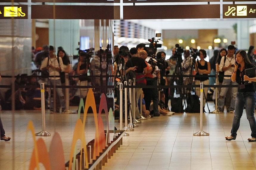 Relatives and next-of-kin of passengers on missing AirAsia flight QZ8501 have begun streaming again at about 8am on Monday morning into the holding area set up for them at Changi Airport's Terminal 2. -- PHOTO: REUTERS&nbsp;