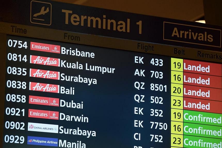 One day after QZ8501 went missing, an AirAsia flight on the same route and carrying the same code from Surabaya to Singapore landed at Changi on Dec 29, 2014. -- ST PHOTO:&nbsp;NG SOR LUAN