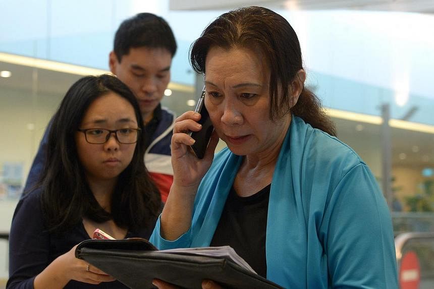 The middle-aged woman who told reporters at Changi Airport that she was Ms Yuni's agent. -- ST PHOTO: NG SOR LUAN&nbsp;
