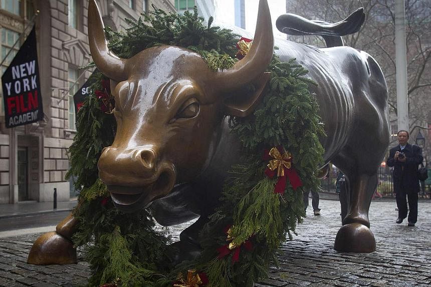 On Wall Street last week - shortened by the Christmas holiday - the Dow Jones Industrial Average gained 1.4 per cent while the Standard &amp; Poor's 500 Index rose 0.9 per cent - both hitting fresh all-time highs. -- PHOTO: REUTERS