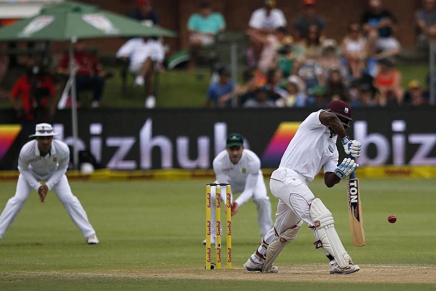 West Indies batsman Kraigg Brathwaite (right) plays a shot during the third day of the second cricket Test match between South Africa and the West Indies at St George's Park in Port Elizabeth on Dec 28, 2014. -- PHOTO: AFP