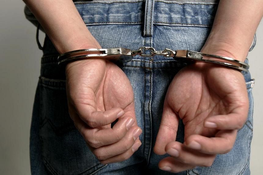 Police have arrested a 24-year-old man and a 55-year-old woman for their alleged involvement in loanshark activities. -- PHOTO: ST FILE