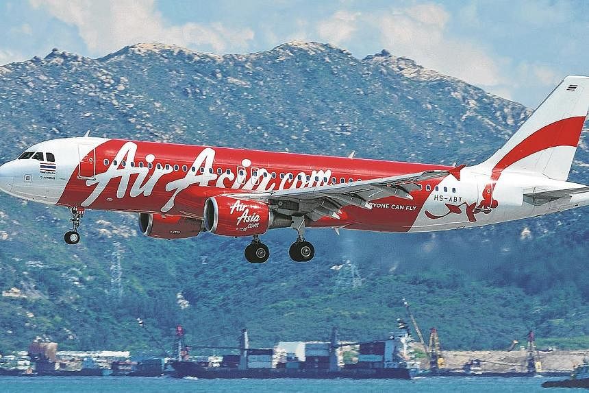 An AirAsia flight bound for north-east Thailand turned back to the capital Bangkok shortly after takeoff on Tuesday when pilots detected an "irregularity" in the storage compartment, airline officials said. -- PHOTO: AFP