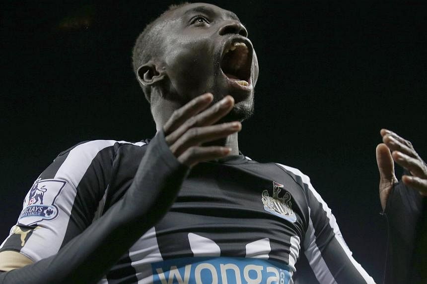 Newcastle United's Papiss Demba Cisse celebrates after scoring a goal against Everton during their English Premier League soccer match at St James' Park in Newcastle, northern England Dec 28, 2014. -- PHOTO: REUTERS