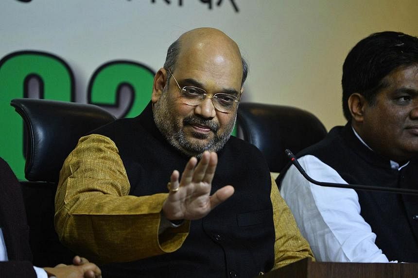 Amit Shah (centre), the head of India's ruling Bharatiya Janata Party&nbsp;and the closest aide of Indian Prime Minister Narendra Modi, was acquitted of three murder charges on Tuesday, Dec 30,2014, in a trial that had undermined the government's pro