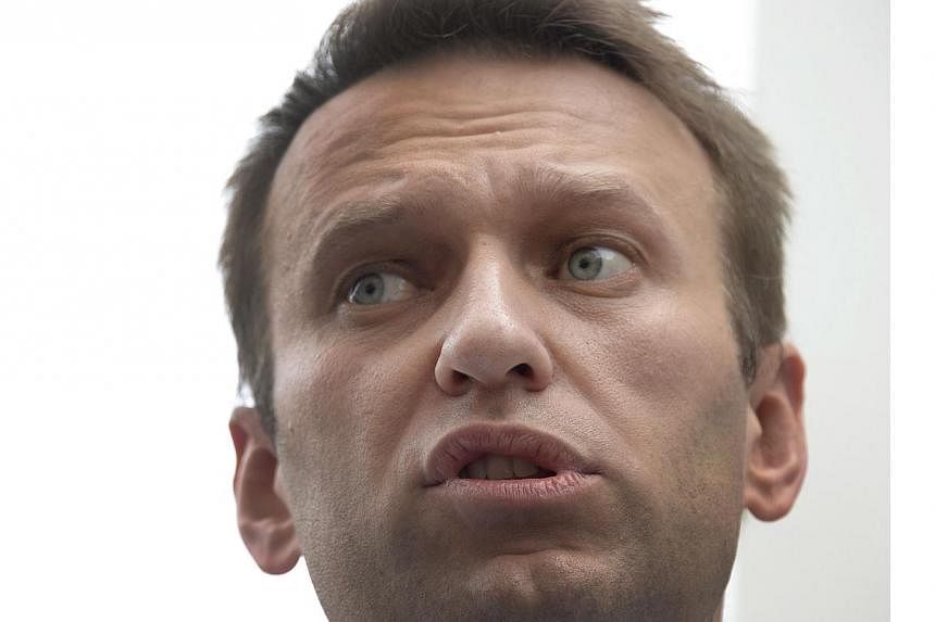 Russia has suddenly brought forward the verdict on top anti-Kremlin figure Alexei Navalny's (above) fraud trial to Tuesday after thousands of his supporters pledged to take to the streets next month, his lawyers said. -- PHOTO: AFP