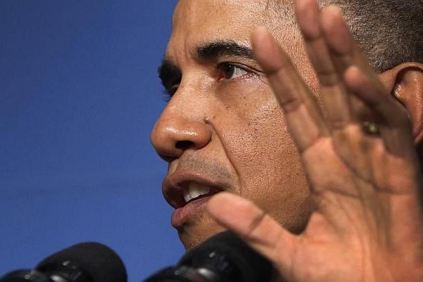 US President Barack Obama (above) said Washington was not ready to open an embassy in Iran due to differences over nuclear policy, a position that contrasts with his new approach to Cuba. -- PHOTO: REUTERS