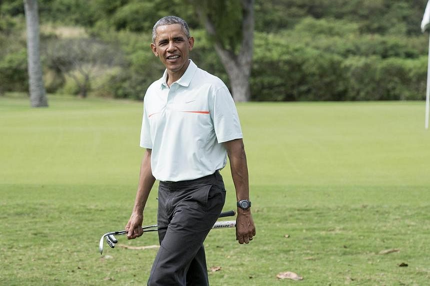President Barack Obama's passion for golf forced two US army officers to relocate their sun-kissed Hawaiian wedding at the last minute. But Obama, seen here (above) on Dec 24, 2014, called them to offer his congratulations and to apologise for any in