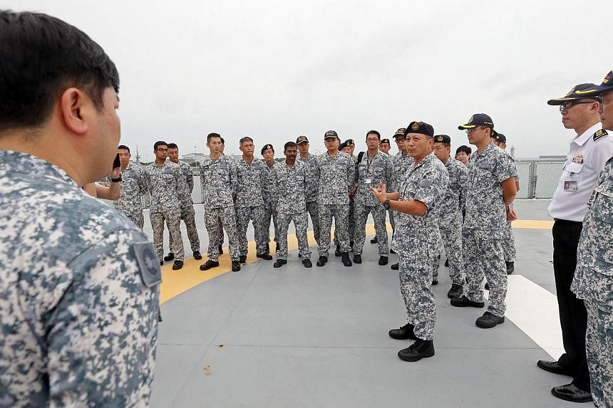 (Fourth from right) Rear Admiral Jackson Chia (Chief of Staff, Naval Staff) speaks to navy personnel of MV Swift Rescue before the ship departs. MV Swift Rescue is the fourth ship to be sent by Singapore to help in the search for QZ8501 departs from 