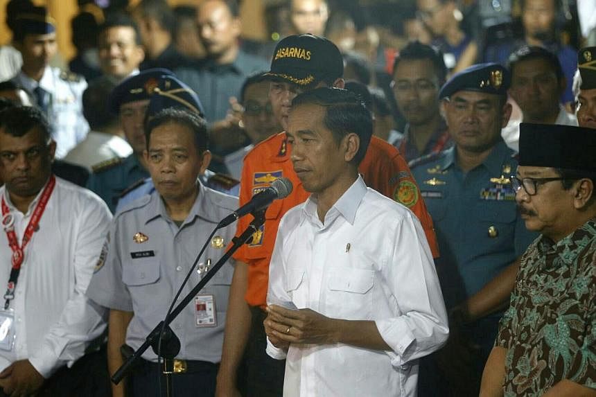 Indonesian president Joko Widodo speaks to the media after arriving at the crisis centre at Juanda International Airport Terminal 2 in Surabaya on Dec 30, 2014. Singapore's leaders have offered their condolences on the crash of AirAsia Indonesia flig