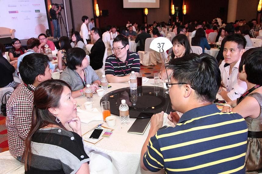 Singles participating in the mass speed dating activity at the finale event Dating Fest 2014, School of Love.&nbsp;The annual Dating Fest has been expanded, with a series of "dating deal" events offering eligible singles up to 50 per cent off selecte