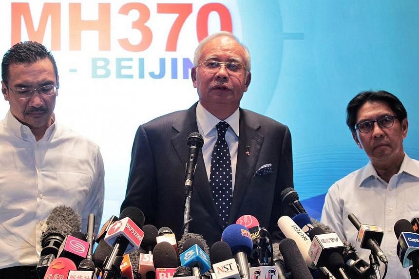 Malaysian Prime Minister Najib Razak (centre), flanked by Defence and then Acting Transport Minister Hishammuddin Hussein (left) and Civil Aviation chief Azharuddin Abdul Rahman at the media briefing of the missing Malaysia Airlines Flight MH370 on M