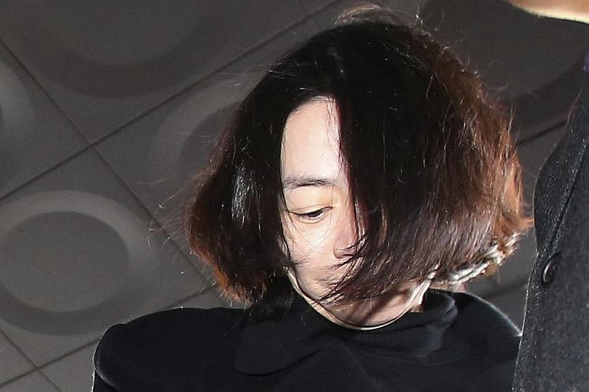 The second daughter of Korean Air's chief executive apologised Wednesday for swearing "revenge" in a text message to her sister Heather Cho Hyun Ah (pictured), who has been arrested for delaying a flight with a tantrum over snacks. -- PHOTO: REUTERS&