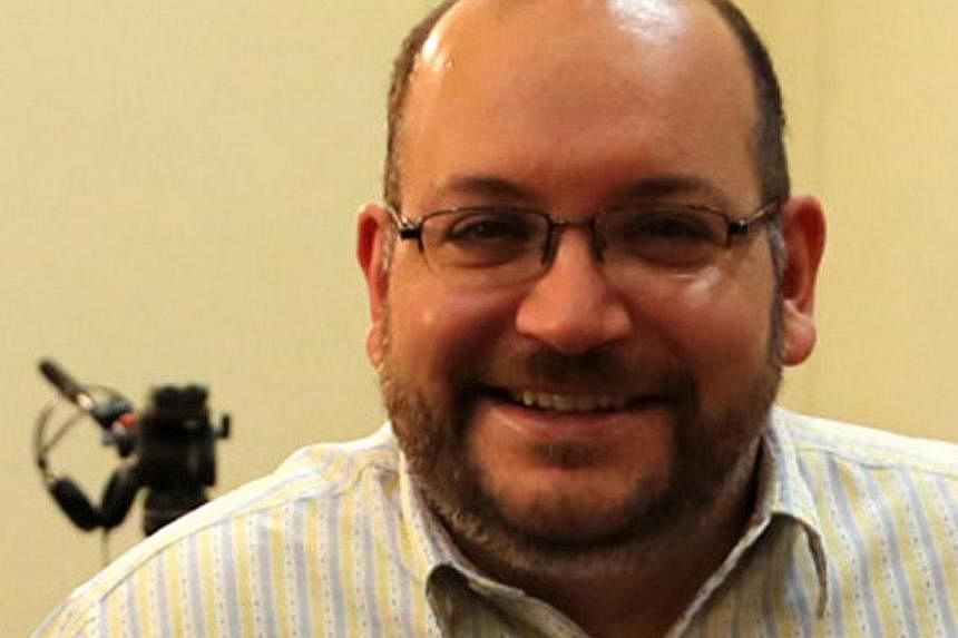 The United States called on Tuesday for the release of US citizens held in Iran - including Jason Rezaian (above) an Iranian-American with dual citizenship - but denied a report that Washington had proposed a prisoner exchange for a former US Marine.