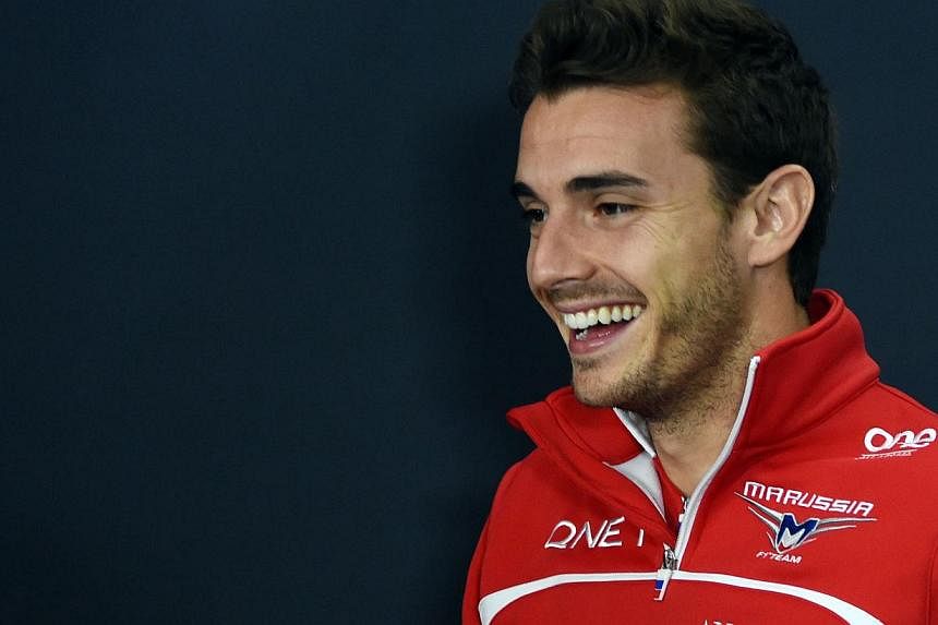 An Oct 2, 2014 picture shows Marussia driver Jules Bianchi of France smiling after a press conference for the Japanese Formula One Grand Prix, at which he was severely injured. -- PHOTO: AFP