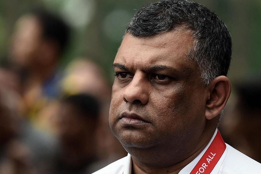 AirAsia Group founder and CEO Tony Fernandes waits prior to attending a press conference concerning missing Malaysian air carrier AirAsia flight QZ8501 at the crisis-centre set up at Juanda International Airport in Surabaya on Dec 29, 2014. -- PHOTO: