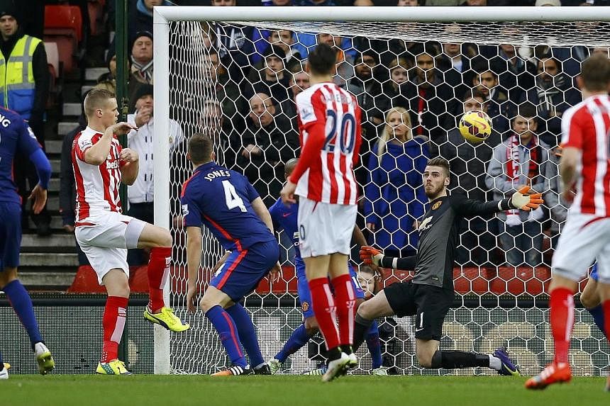 Stoke City's Ryan Shawcross (second left) shoots to score a goal during their English Premier League soccer match against Manchester United at the Britannia Stadium in Stoke-on-Trent, central England Jan 1, 2015. -- PHOTO: REUTERS