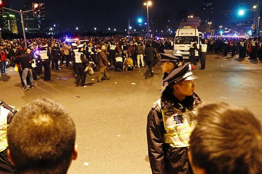 Police control the site of the stampede on Jan 1, 2015. -- PHOTO: REUTERS&nbsp;