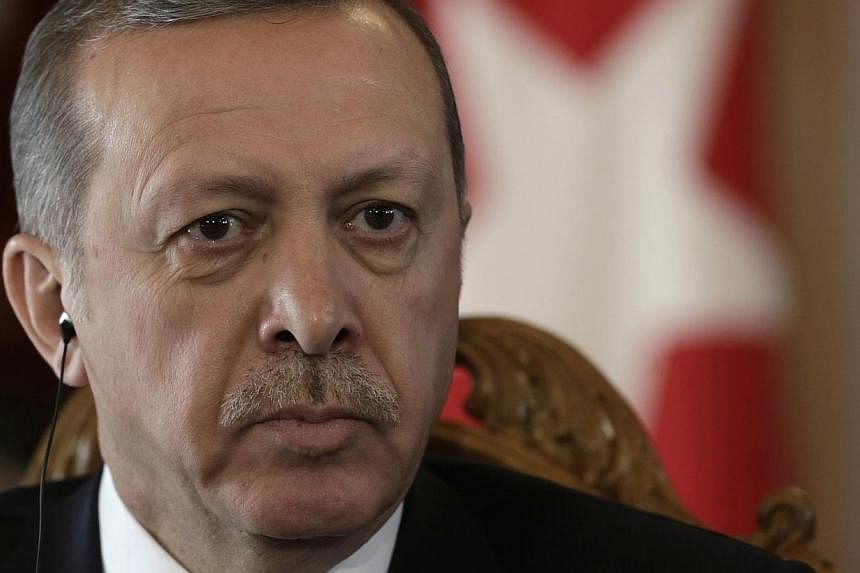 Turkish police said Thursday that a suspected “terrorist” armed with grenades and old guns was arrested after a failed attack near the office in Istanbul of President Recep Tayyip Erdogan (above).&nbsp;-- PHOTO: REUTERS