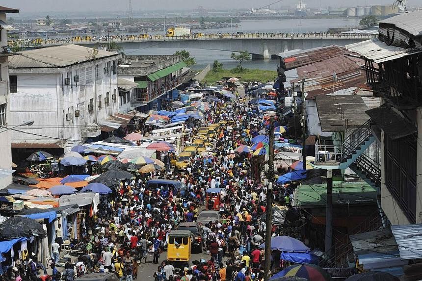 A packed street in Monrovia on Dec 23, 2014.&nbsp;Ebola-ravaged Liberia on Wednesday lifted a night curfew in place since August to allow New Year's Eve services. -- PHOTO: REUTERS