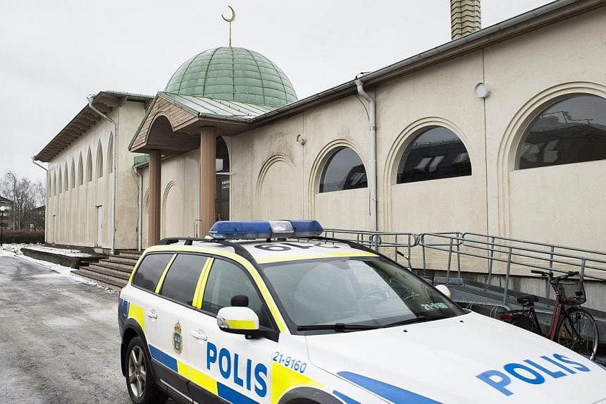 A police car is parked in front of a mosque in Uppsala, Sweden, on Jan 1, 2015. A Molotov cocktail was thrown at the mosque early on Thursday. -- PHOTO: REUTERS