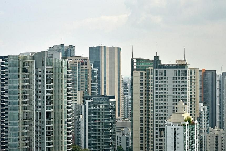 Experts reckon that the slowdown in private property prices in the last quarter of 2014 was characteristic, thanks to the year-end holiday period, ailing demand and curtailed home financing. -- PHOTO: ST FILE