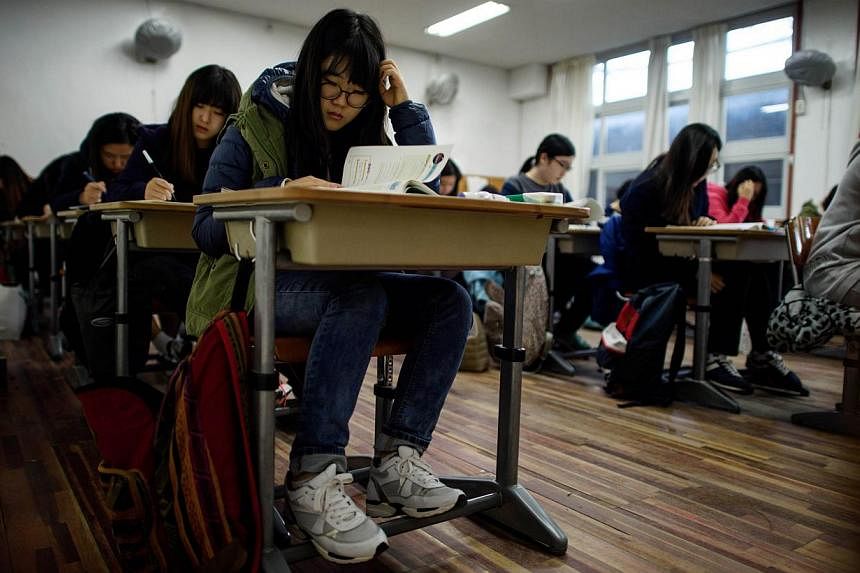 Students sitting the annual Scolastic Aptitude Test at Poongmun High School in Seoul on Nov 13, 2014. Youth unemployment hit a 14-year high in South Korea in 2014, and with hiring sluggish amid a weak economy, especially for "good" jobs with permanen