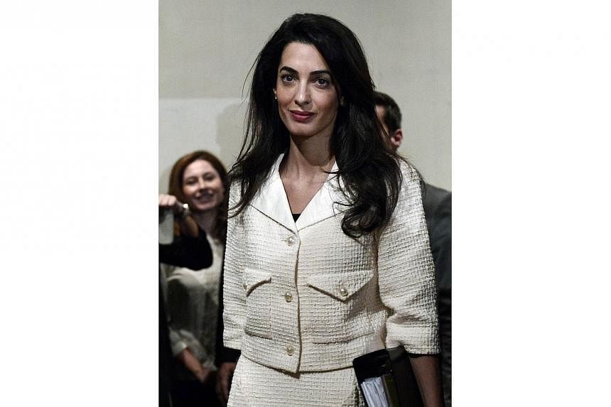 Human-rights lawyer Amal Clooney at a press conference at the Acropolis museum in Athens on Oct 15, 2014. Clooney claimed in an interview published on Saturday that she was threatened with arrest in Egypt after identifying flaws in the judicial syste