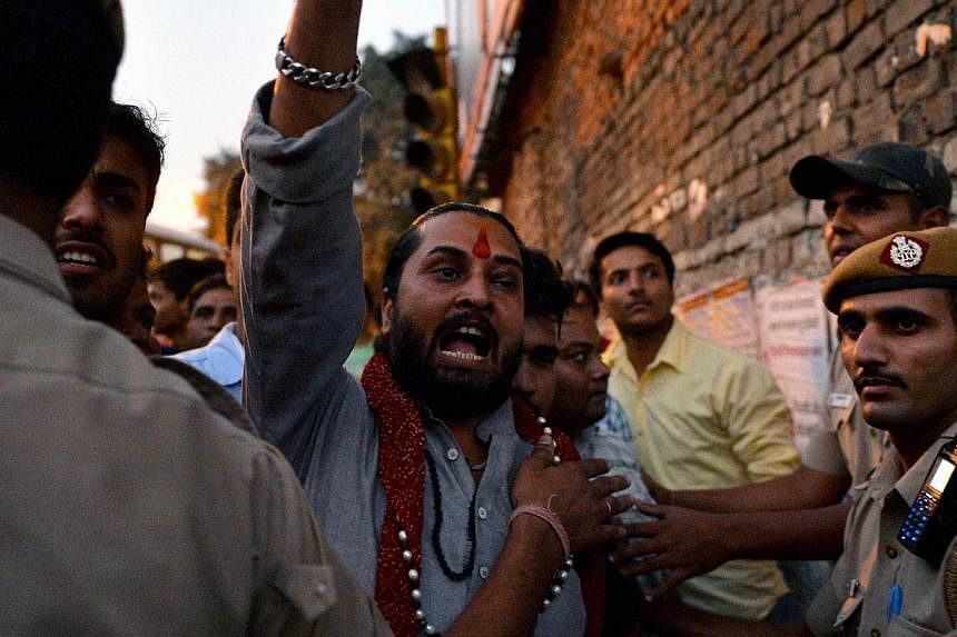 A drummer wearing a Modi mask as BJP supporters celebrated the party's victory in the Jharkhand state assembly polls last month. The BJP also broke a critical psychological and political barrier in Jammu and Kashmir, nearly doubling its vote share. B