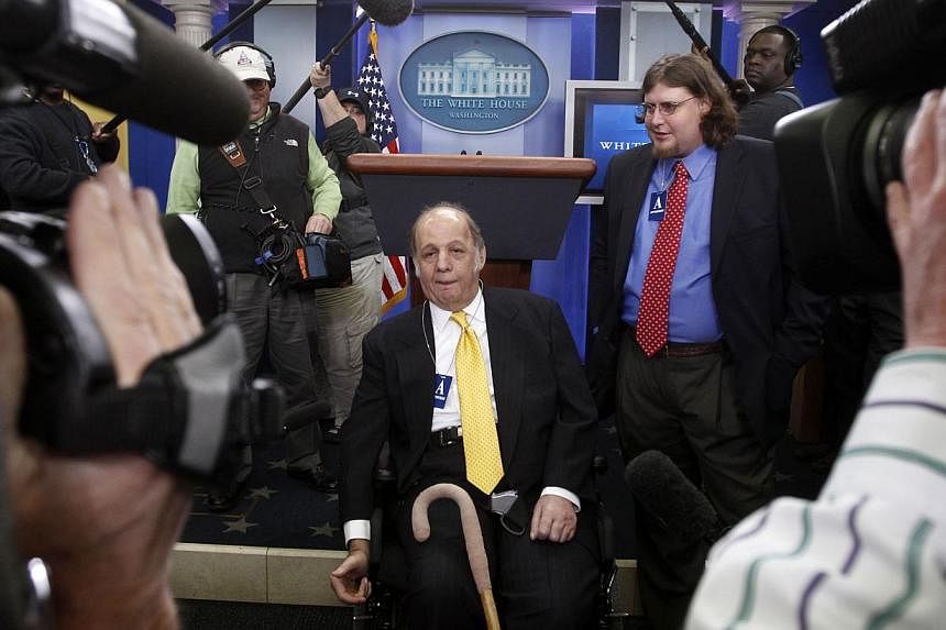 Former White House press secretary James Brady in a March 2011 picture showing him and his son, Scott (right), during a visit to the White House Press Briefing Room in Washington. Would-be presidential assassin John Hinckley Jr will not face criminal
