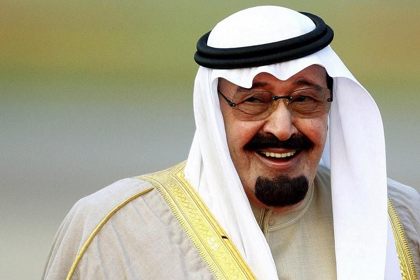 Saudi King Abdullah (above), hospitalised earlier this week, is suffering from pneumonia and breathing with the aid of a tube, but is in stable condition, the royal court said on Friday. -- PHOTO: REUTERS