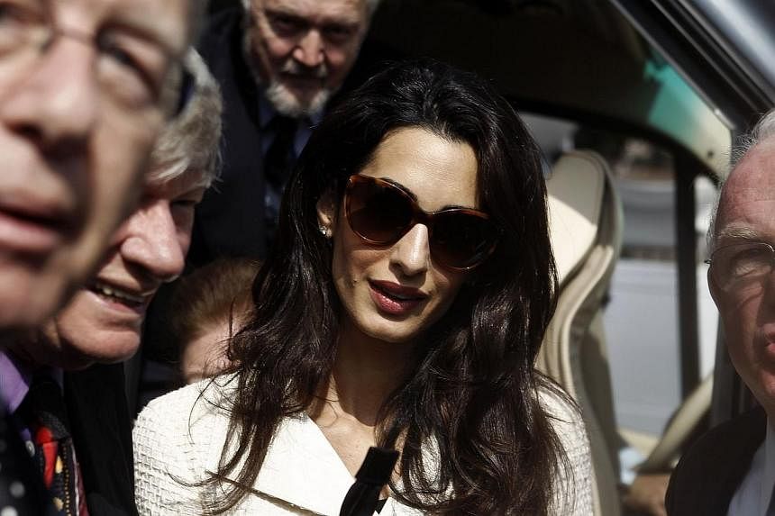 Human rights lawyer Amal Alamuddin Clooney (centre) arrives at the Acropolis museum in Athens in this Oct15, 2014 file photo. -- PHOTO: REUTERS