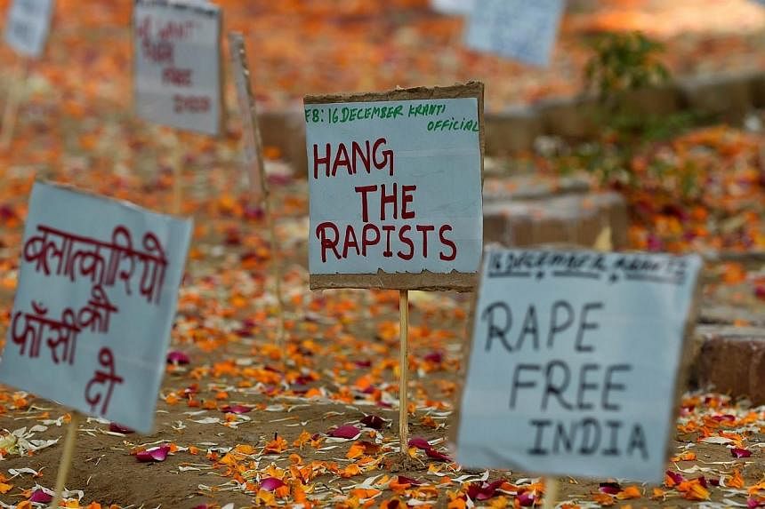 Placards against rape is pictured beside a memorial at the protestor's corner in Jantar Mantar in New Delhi on Dec 16, 2014. -- PHOTO: AFP