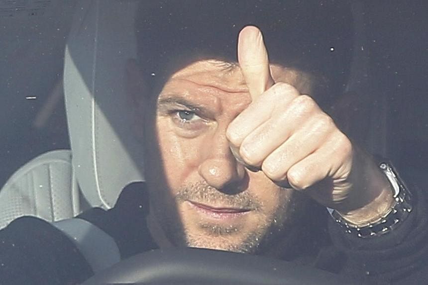 Liverpool captain Steven Gerrard gestures as he leaves the club's Melwood training centre in Liverpool, northern England Jan 2, 2015. -- PHOTO: REUTERS